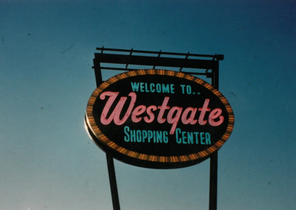 Vintage pylon sign for Westgate Shopping Center against clear sky