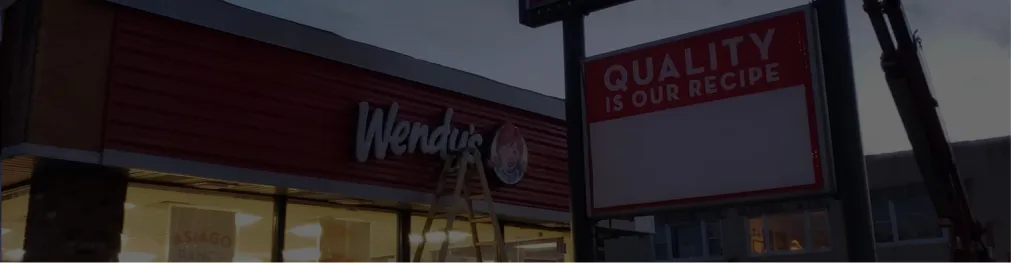 Wendy’s restaurant signage and “Quality is our recipe” pylon sign