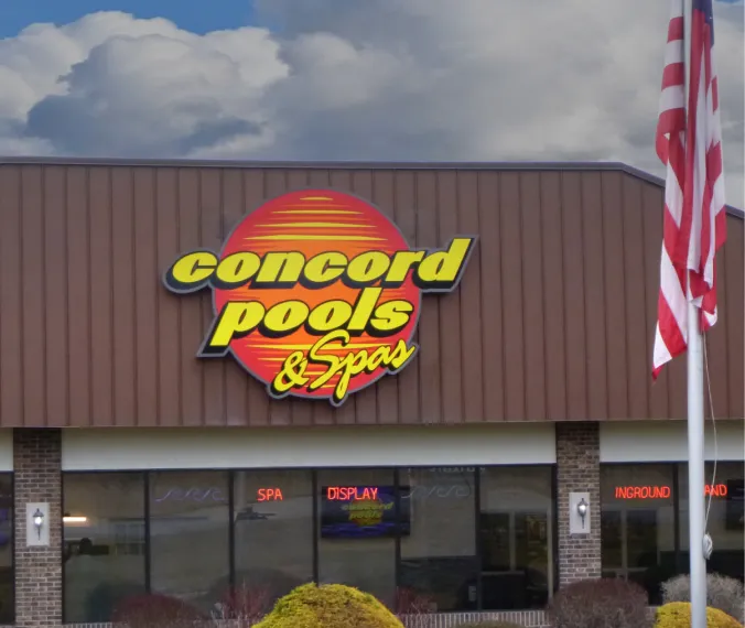 Bold outdoor signage for Concord Pools & Spas on commercial building facade