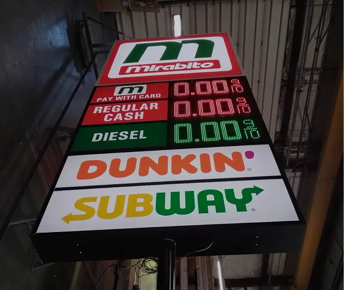 Gas station price sign displaying Mirabito, Dunkin', and Subway logos with digital fuel prices.