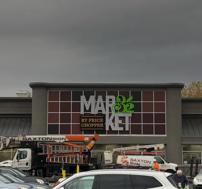 Exterior installation of Market 32 by Price Chopper signage with Saxton equipment