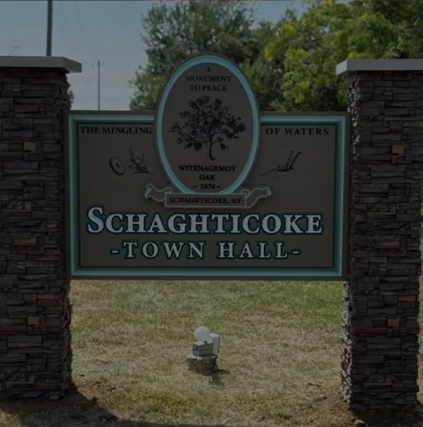 Monument-style sign for Schaghticoke Town Hall with historical and municipal branding.
