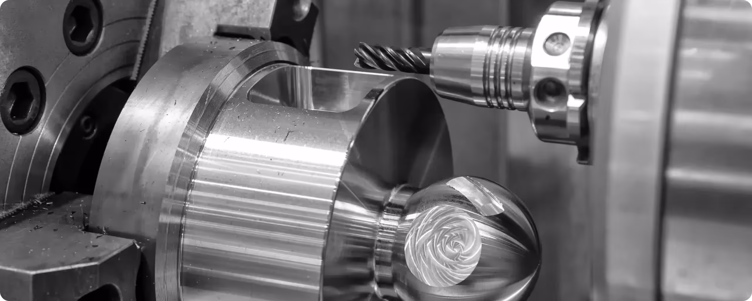 Close-up of a lathe machining a metal part.