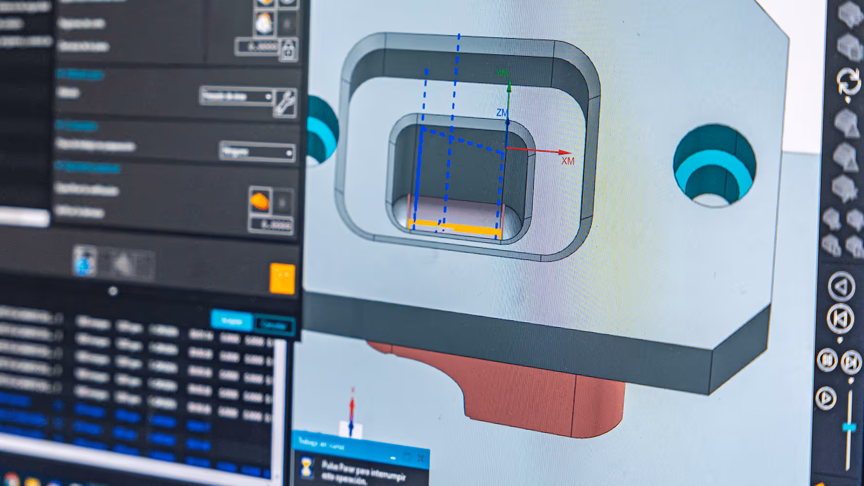 operating a CNC machine control panel with a 3D model on screen
