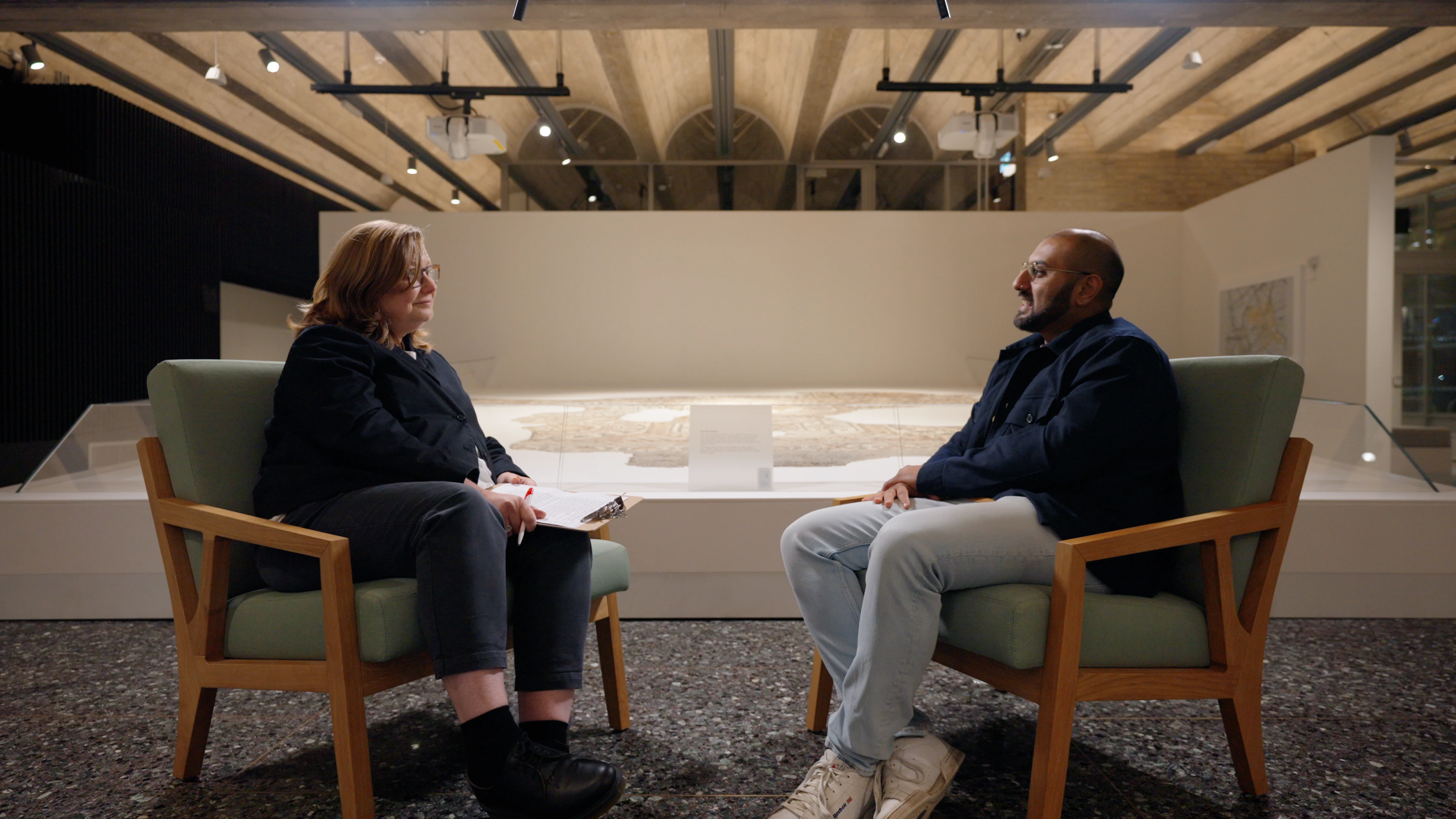 Wide framing of interview set at Jewry Wall Leicester filmed by Rendah Films production on Sony FX3 with motorised slider