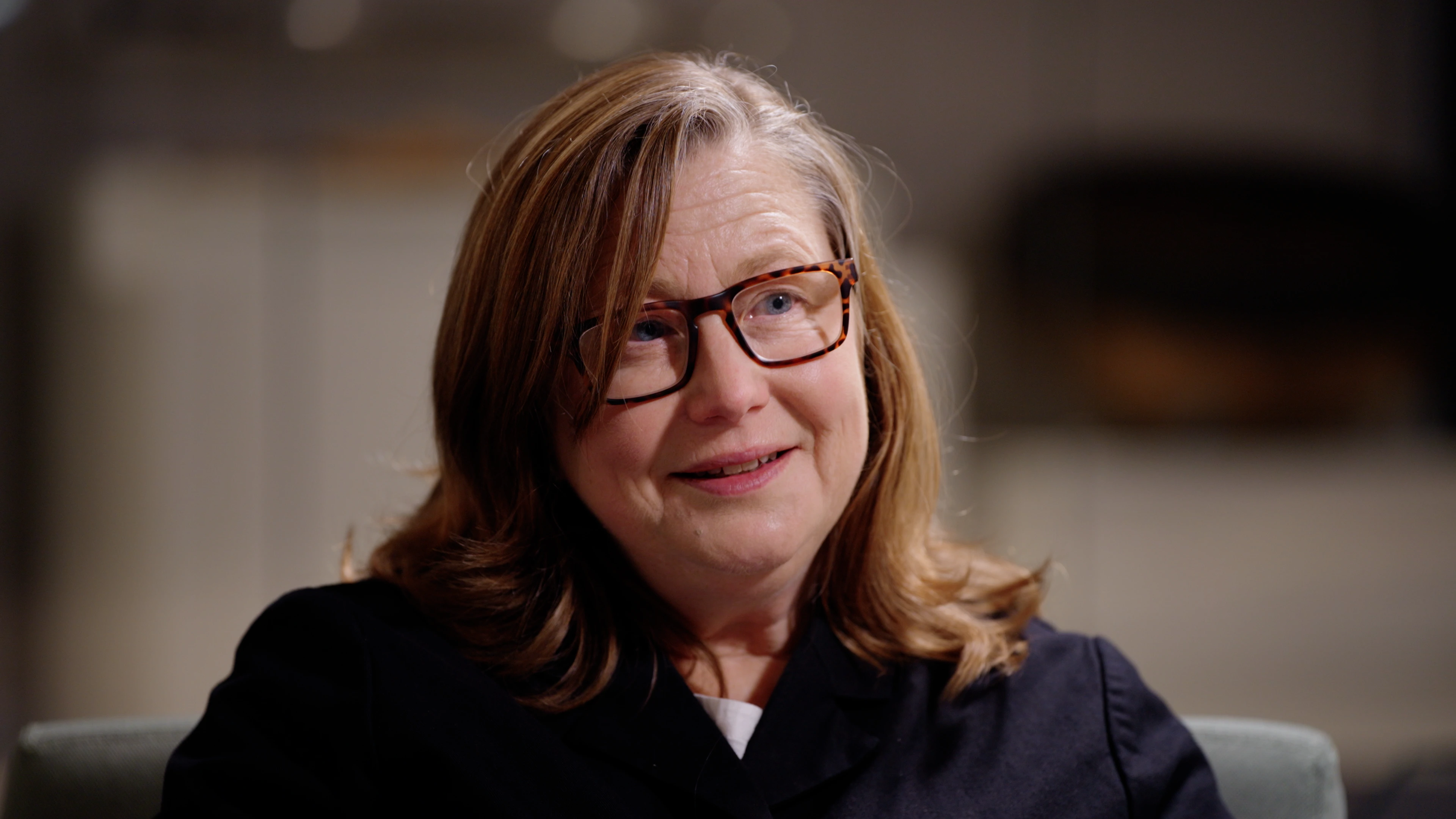 Tight close-up framing of Emma Parker listening during interview at Jewry Wall Leicester filmed by Rendah Films production
