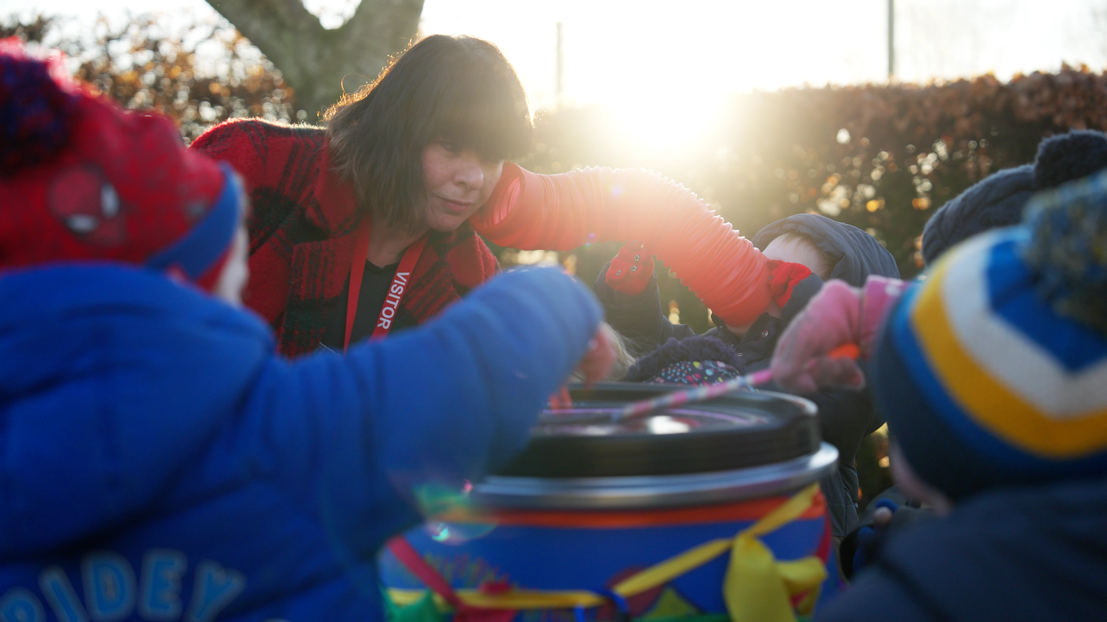 Exploratory play with children and educator interacting together with crafted instruments. Atmoshperic close-up shot from “Loop” mini documentary by Rendah Films.