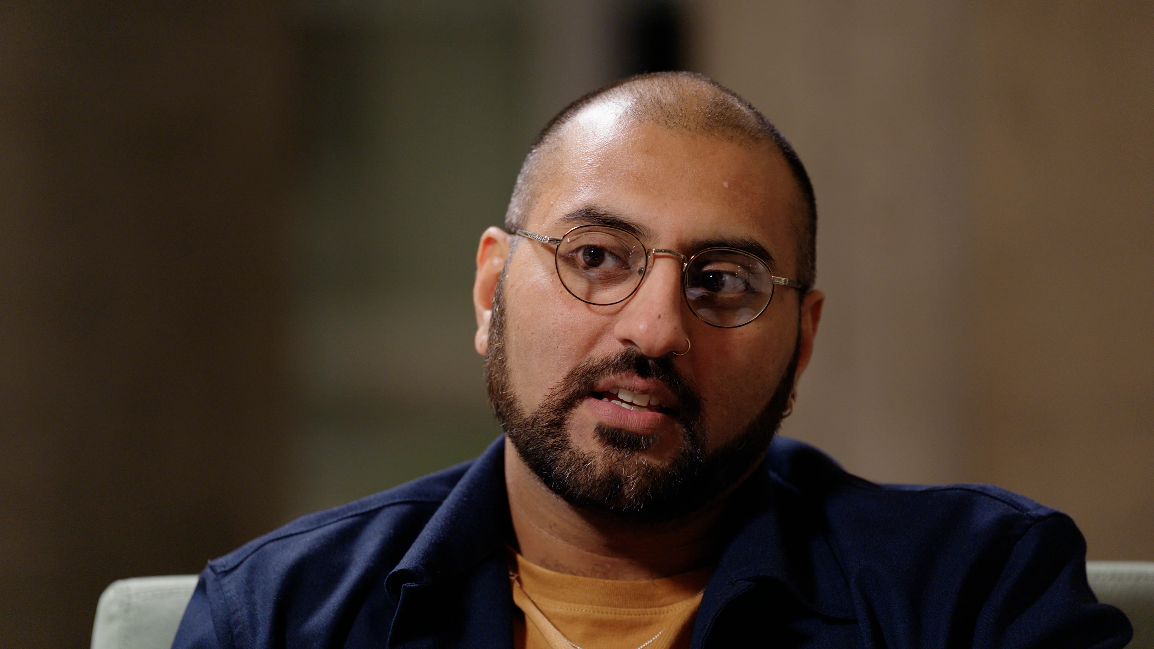 Tight close-up framing of Akshay Sharma during interview at Jewry Wall Leicester by Rendah Films production