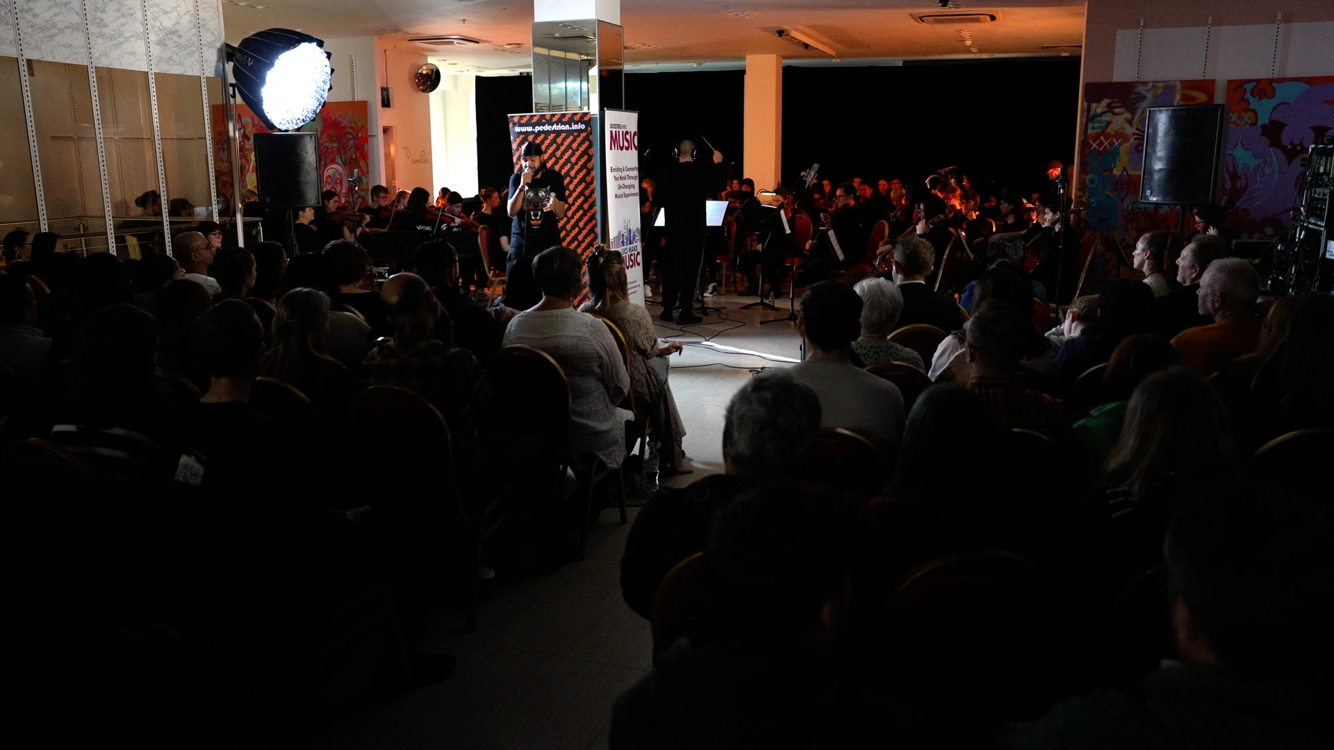 Grime MC performing live in front of audience during Pedestrian flagship project event | Community Creative Documentary Production