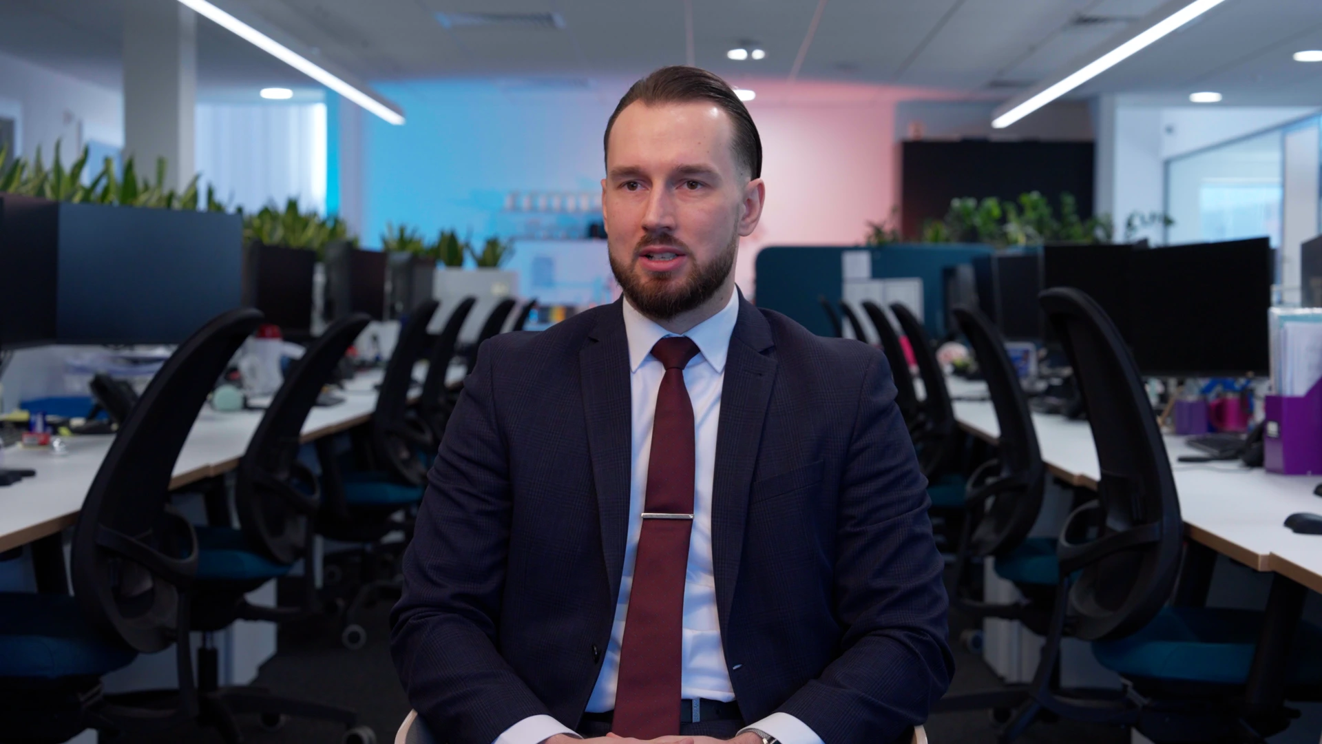 Mid shot of Male financial consultant speaking in open-plan office environment | PSA Financial Services promotional video by Rendah Films