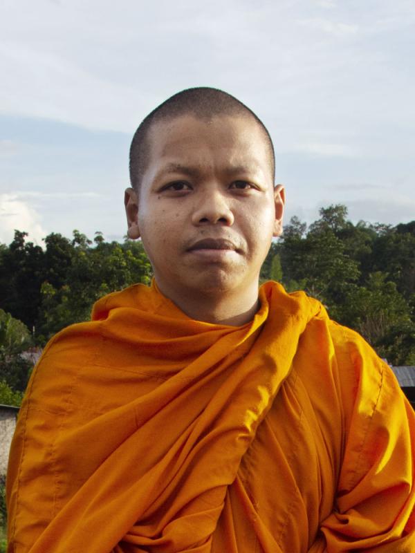 Devoted mission worker in New Zealand, representing Christian ministry with peaceful outdoor devotion. OM New Zealand