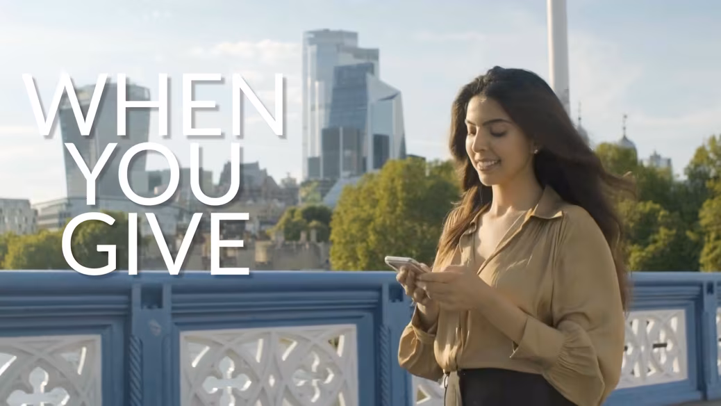 Women in mission, a New Zealander sharing hope from the city bridge. OM New Zealand