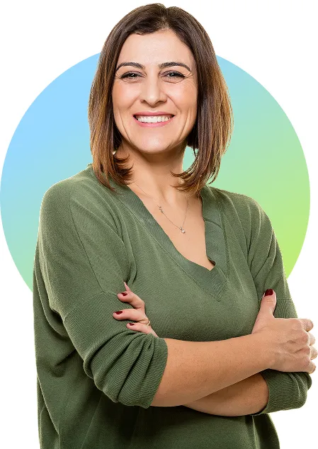 Mature woman standing confidently with her arms crossed 