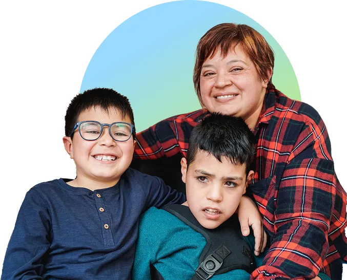 Mother smiling with her 2 young sons