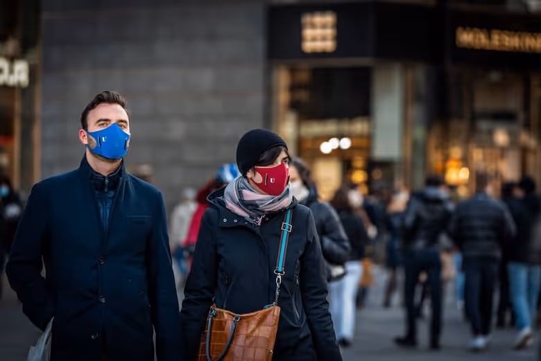 Pedestrians wearing masks