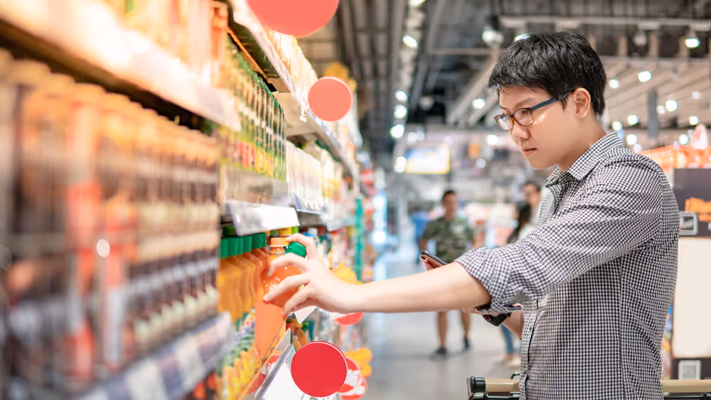 A person shopping for fruit juice