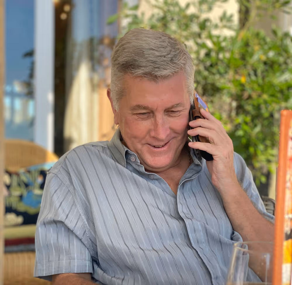 Malcolm Laws, Founder of Aqua-Sol, one the phone to a client