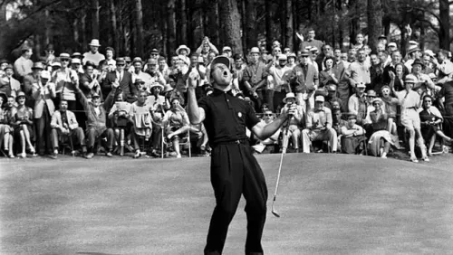 Gary Player celebrates on the green in front of a lively crowd