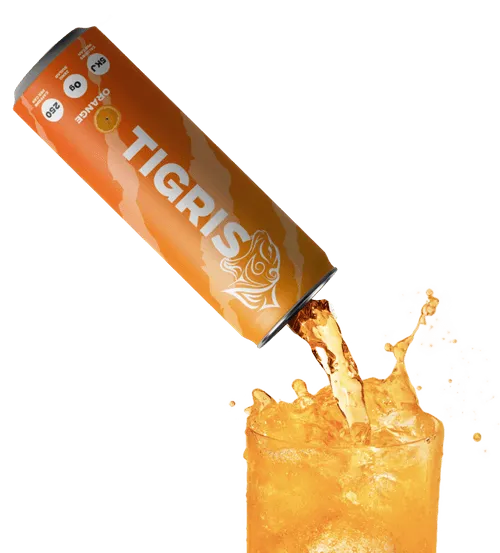 A can of Tigeris is being poured into a glass.