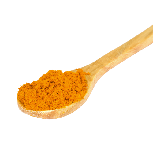 A wooden spoon full of orange spice.