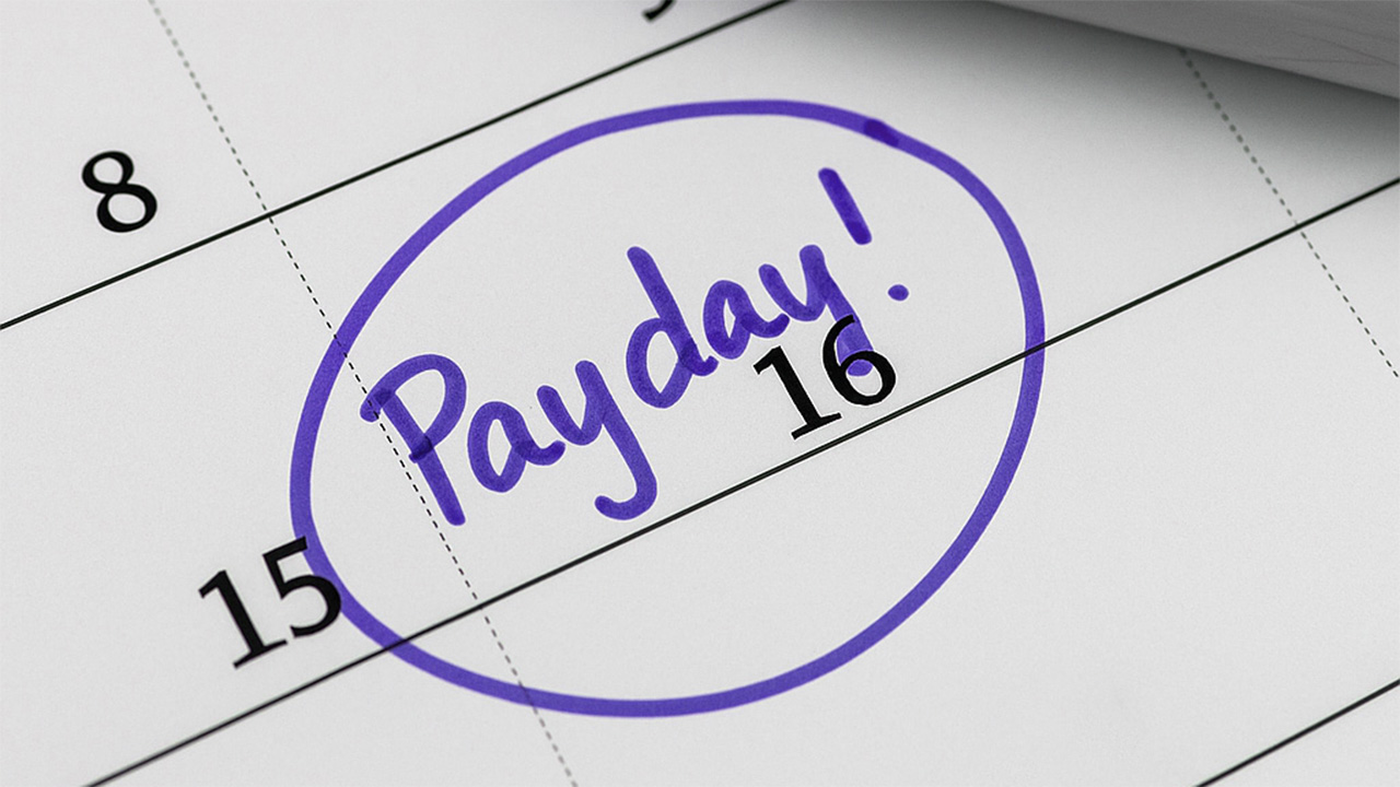 Calendar with the word "Payday!" circled in purple on the 16th.