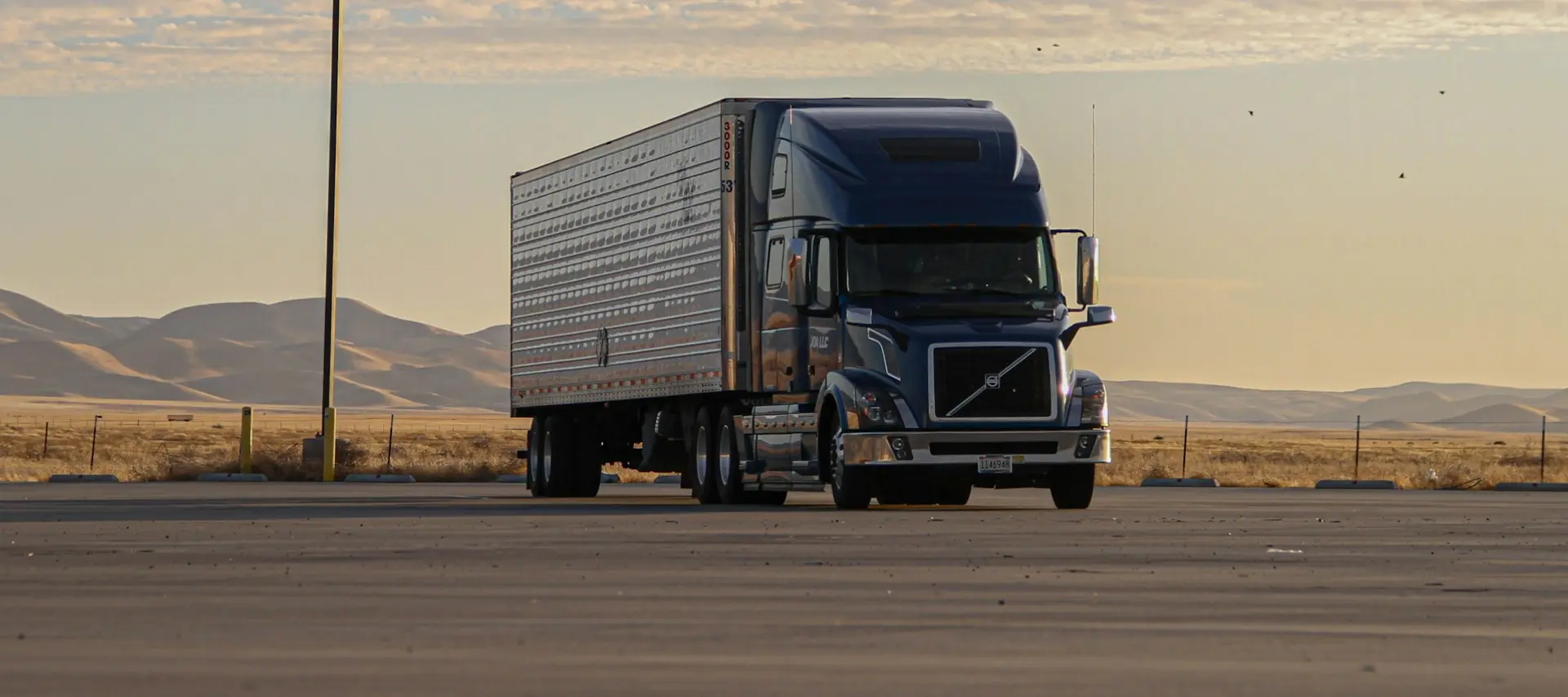 semi truck with freight trailer transporting to another location