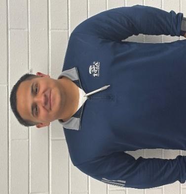 Mr. Alvarez smiling in school staff directory photo