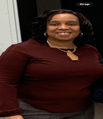 Ms. Wilkins smiling staff member at MS 53 school