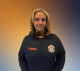 Ms. Rodriguez staff member in school sweatshirt