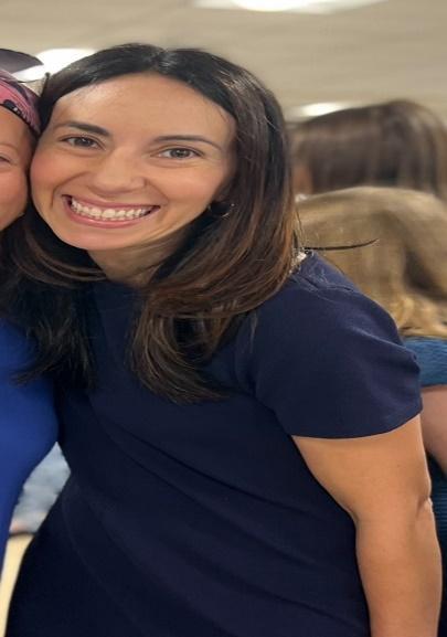 Mrs. Weissman smiling at a school event
