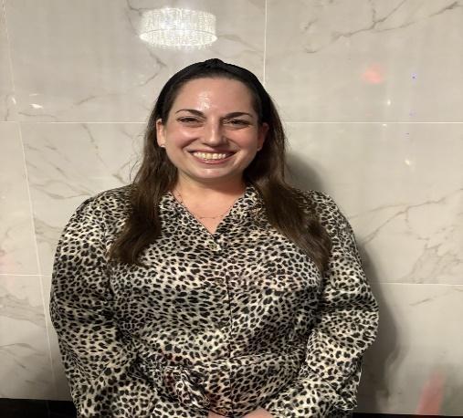 Mrs. Pollack smiling in a leopard print blouse