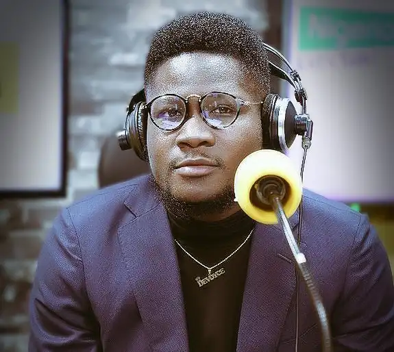 Anthony Devoyce in studio wearing a suit