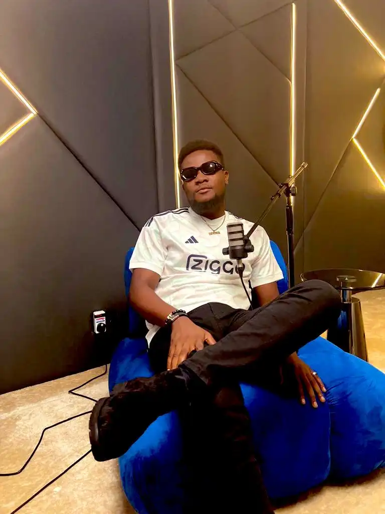 Anthony Devoyce in a studio wearing a jersey