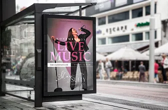 a bus stop with a poster of a woman singing 