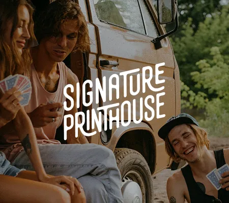 a group of people sitting in front of a van for Signature Printhouse