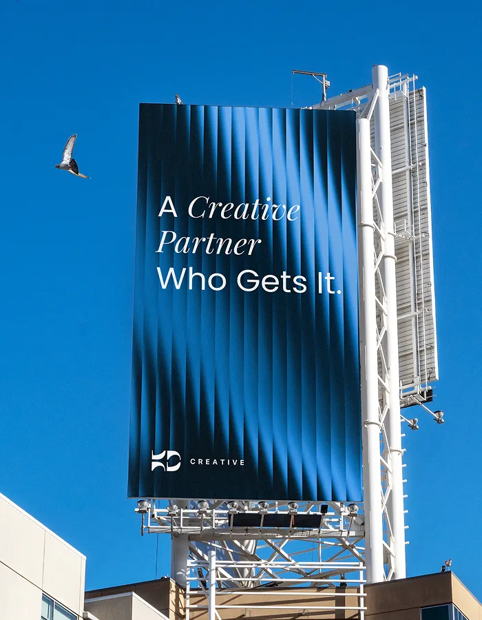 creative agency billboard with a bird flying in the sky