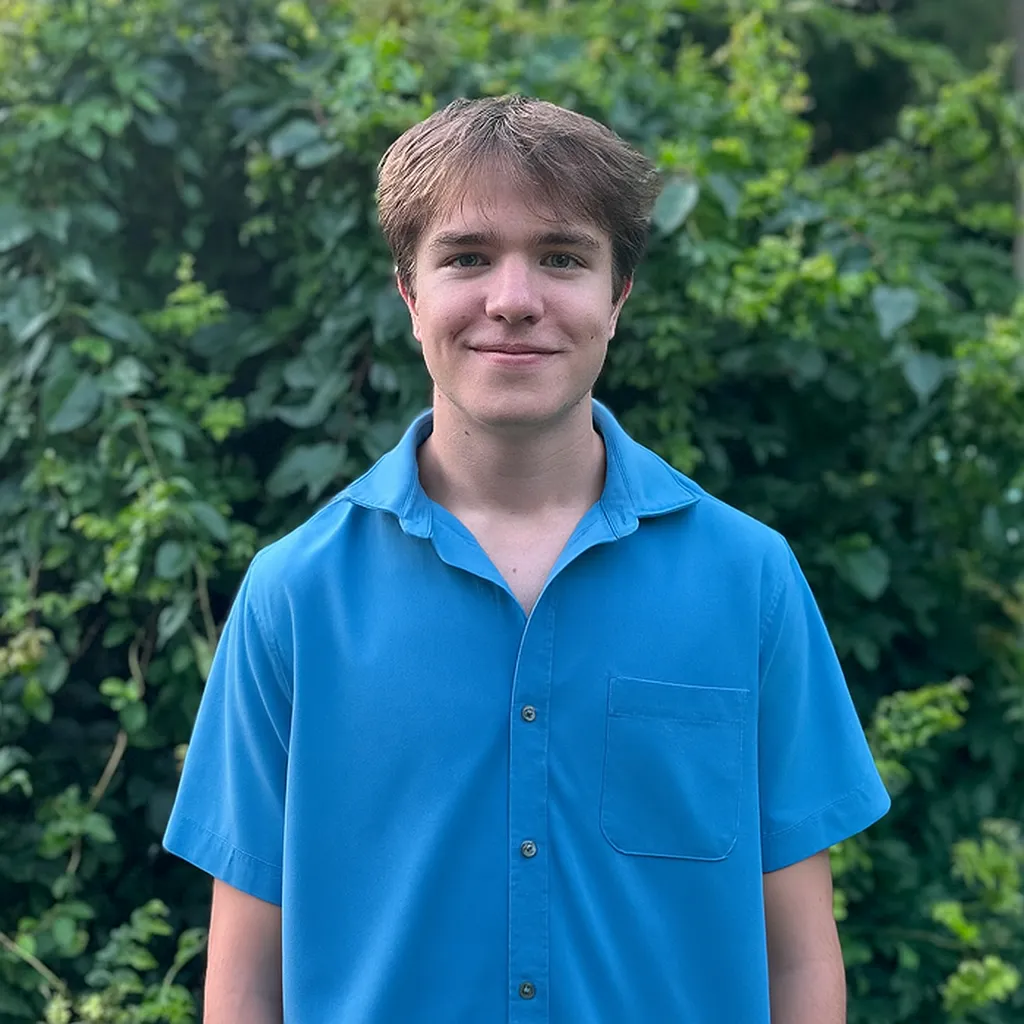 a man in a blue shirt, Nick Bishop marketing director
