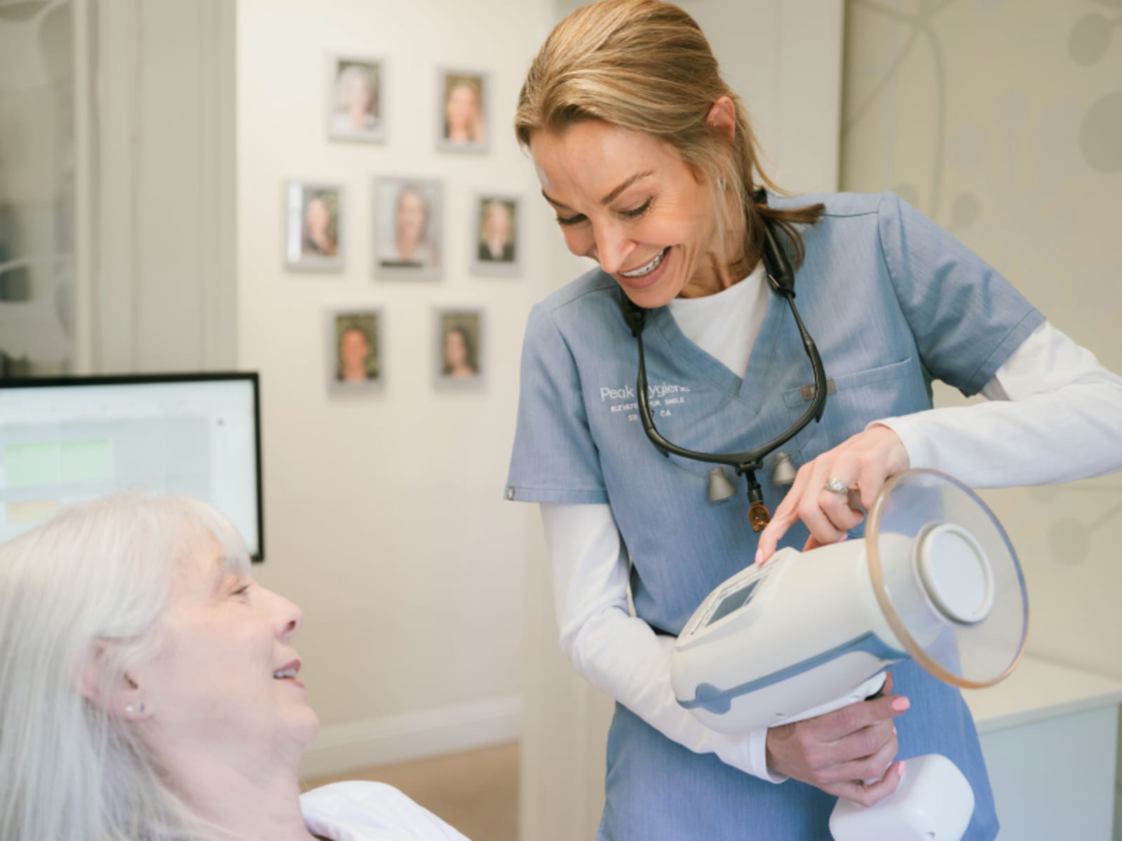 Dentist demonstrating a dental model to a patient in the office