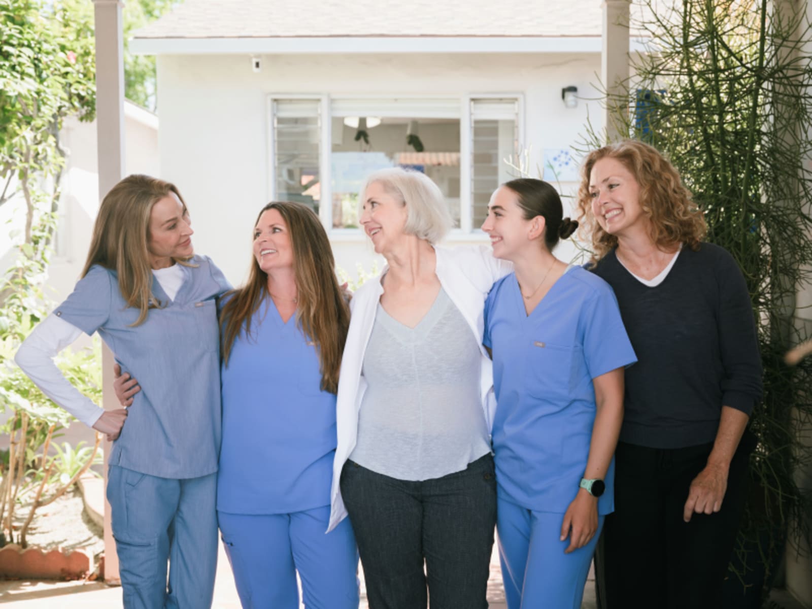 Whole Health Dentistry team standing together in the office reception area