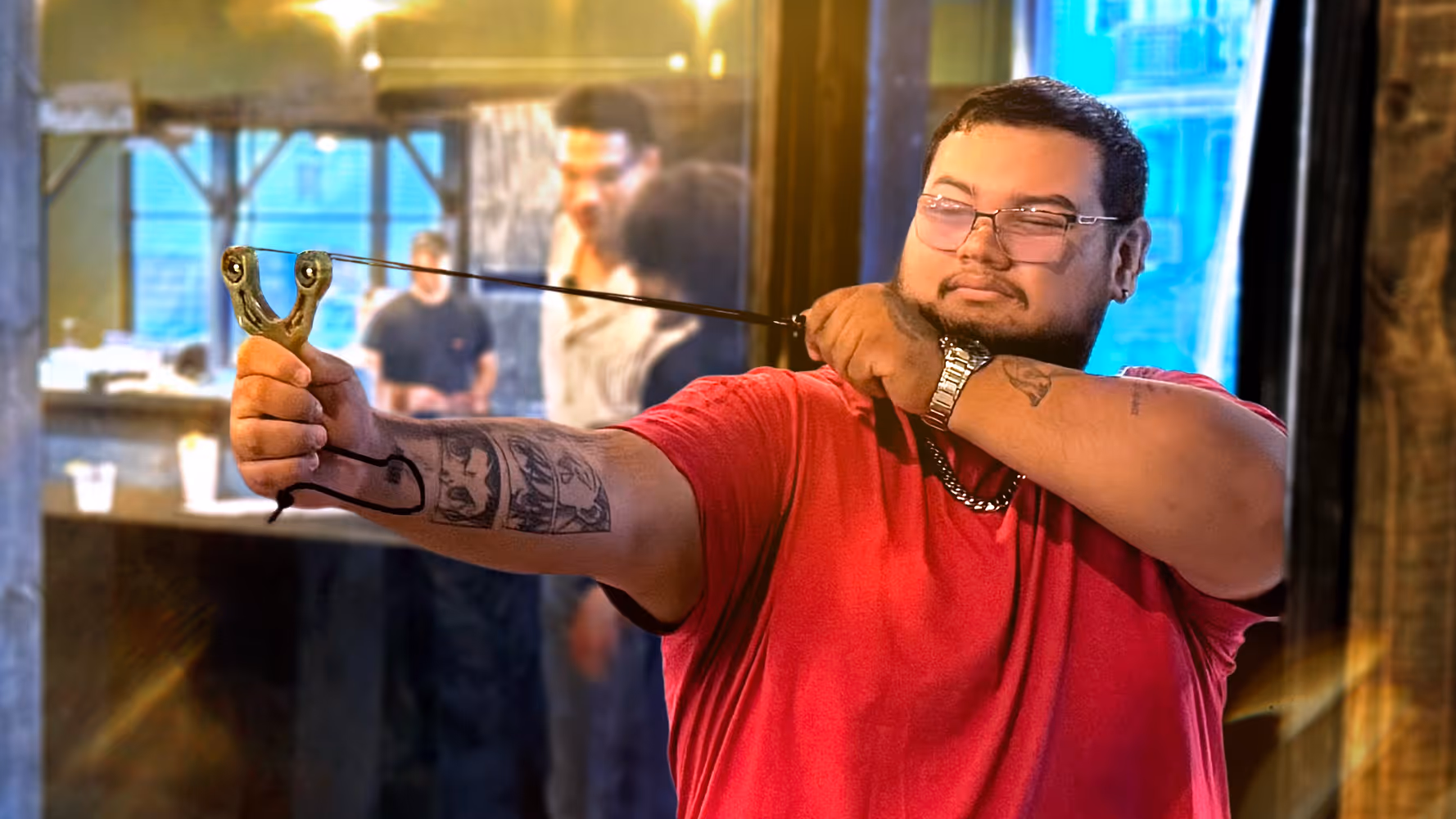 Slingshot Bar guest takes aim from their Bay.