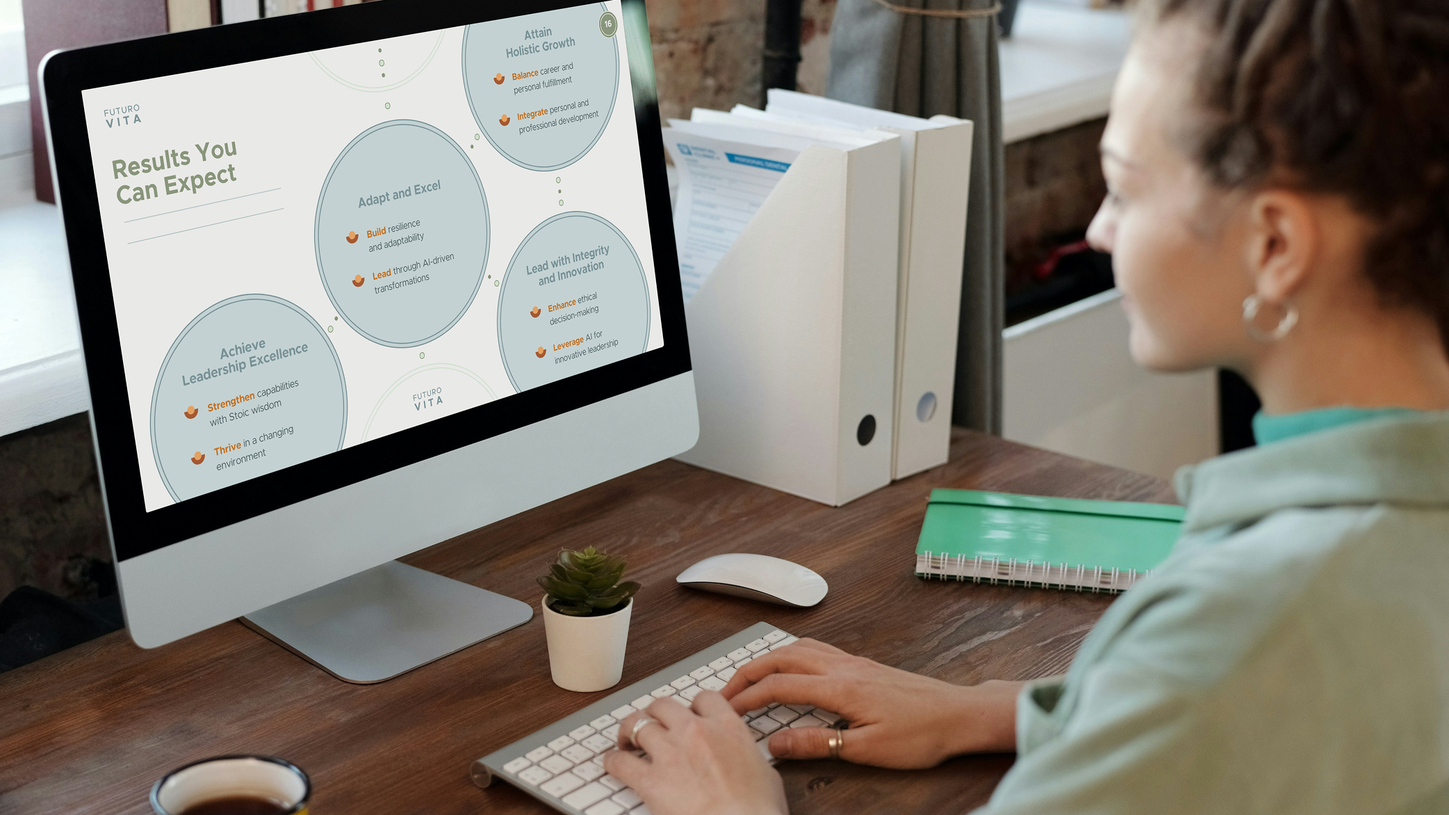 Person typing on keyboard at desk looking at computer screen displaying a page titled 'Results You Can Expect' with circular text boxes about leadership and growth.