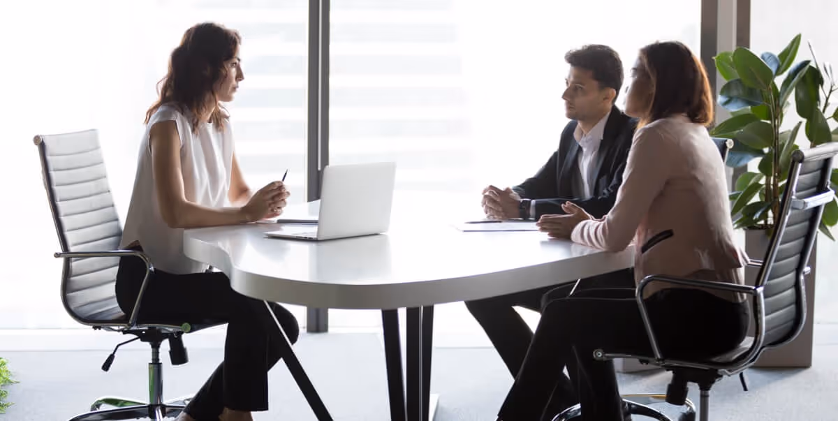 couple-talking-with-female-lawyer