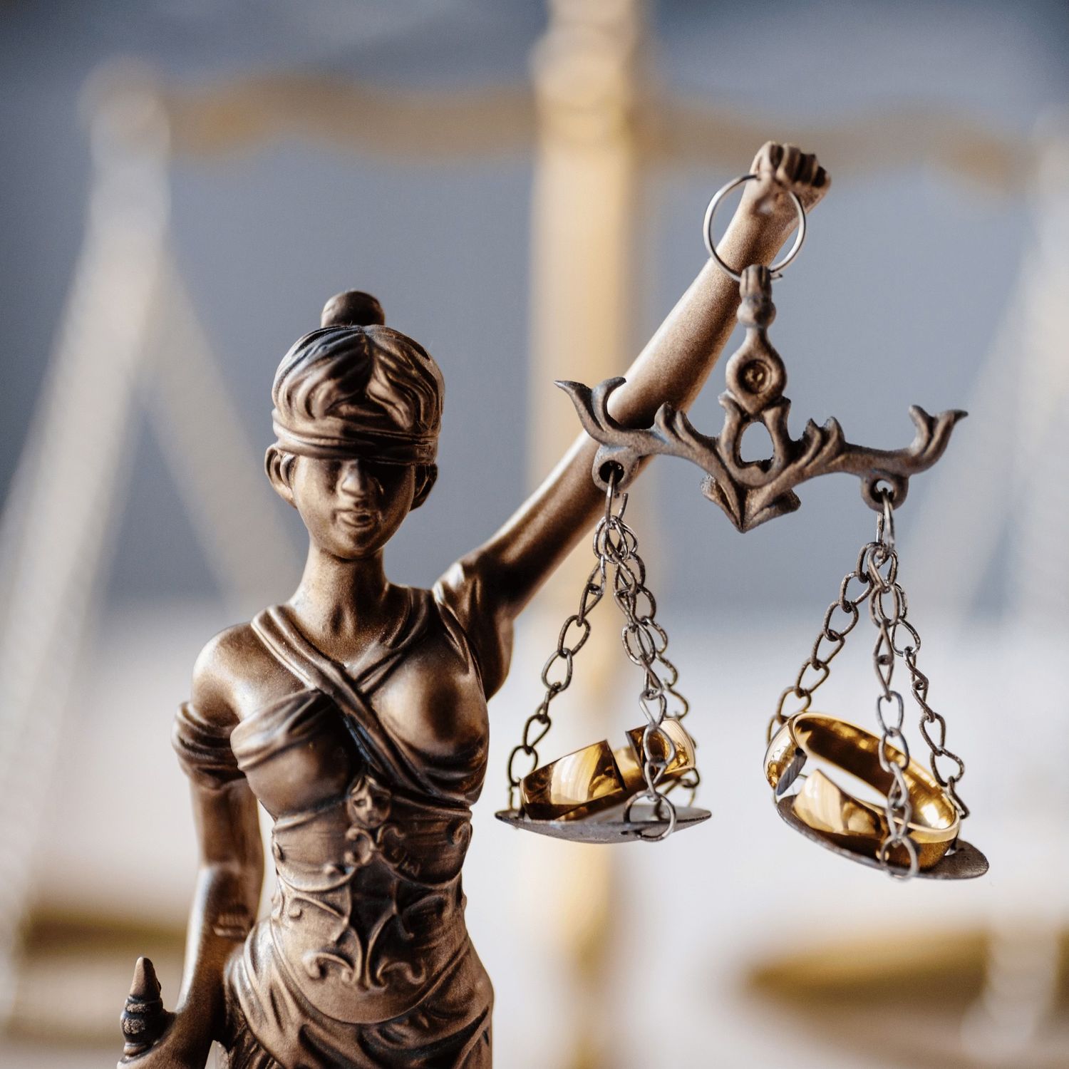 Statue of Lady Justice holding balanced scales