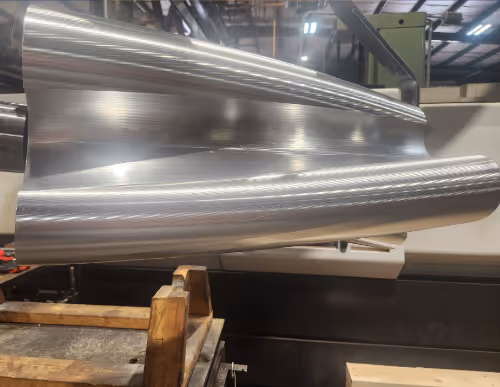 Precision CNC machined Roots blower rotors with polished finish by Burns Machine Company.