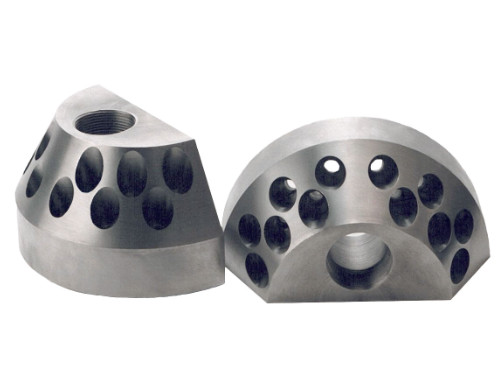 Precision CNC machined semi-cylindrical metal parts with drilled holes by Burns Machine Company.