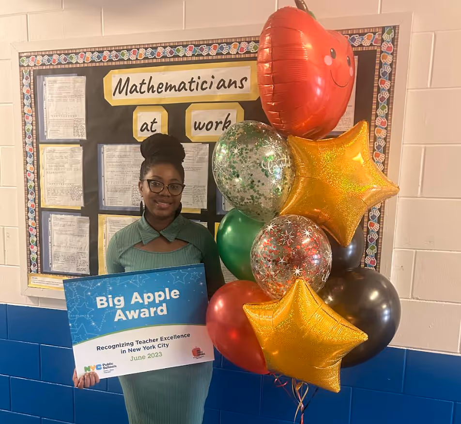 "Teacher wins Big Apple Award"










