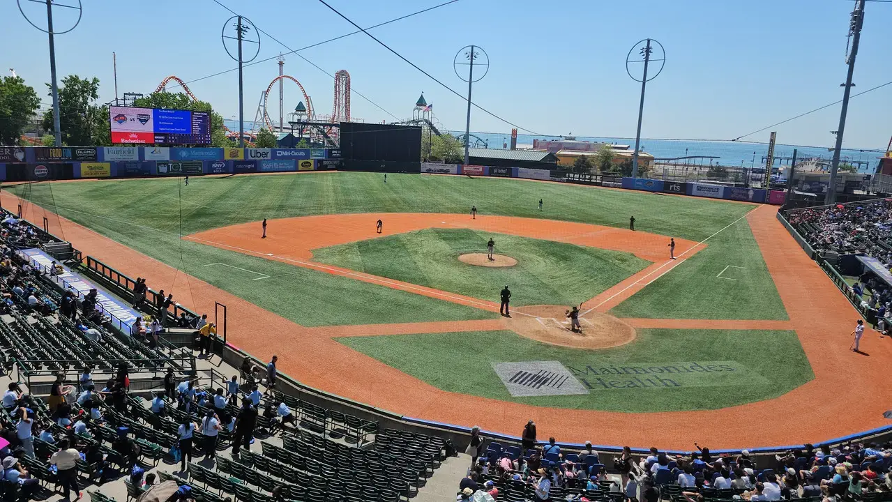 Students attending a baseball game at a minor league stadium