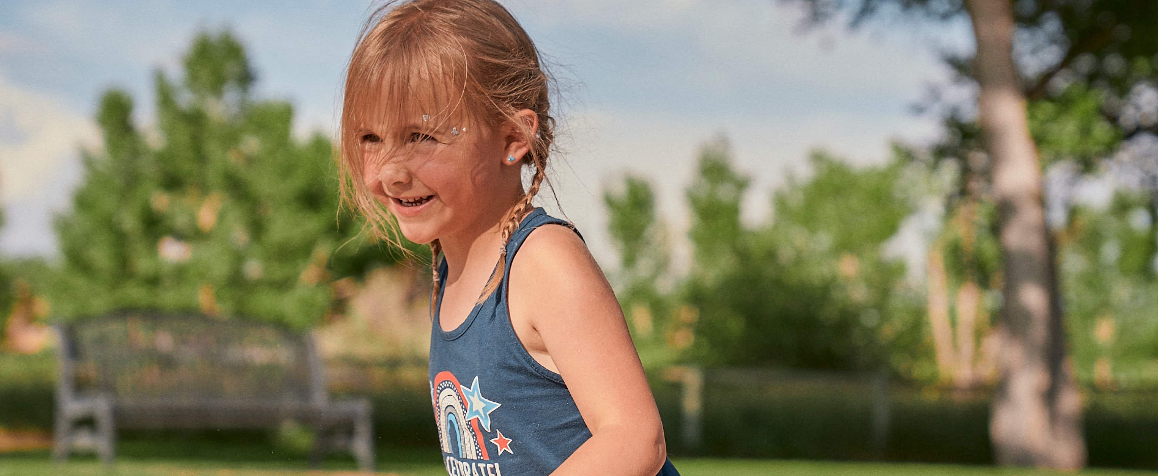 Girl smiling at the playground.