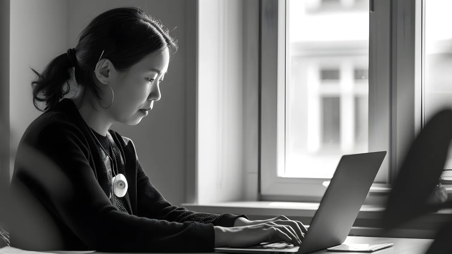 Healthcare professional working on laptop for CMS GUIDE documentation