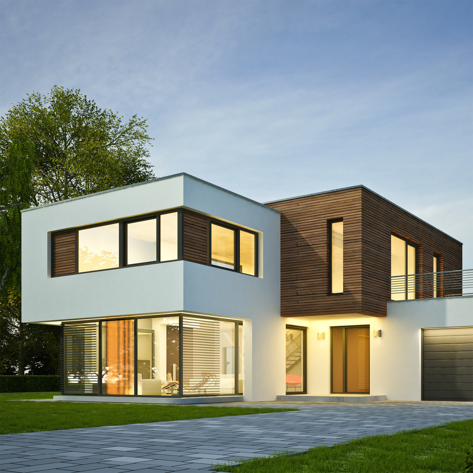 Image of a house with warm lighting inside.